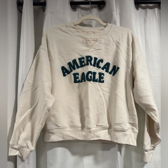 American Eagle Outfitters Tops - American Eagle Womens Cream Logo Graphic Crewneck Sweatshirt Size Small Pullover